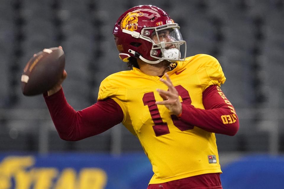 Southern California quarterback Caleb Williams (13) practices ahead of the Cotton Bowl NCAA college football game against Tulane, Thursday, Dec. 29, 2022, in Arlington, Texas. The Cotton Bowl is scheduled for Monday, Jan. 2, 2023. (AP Photo/Sam Hodde)