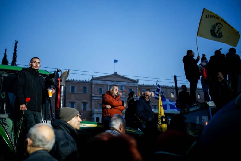 Farmers stand on their tractors in front of the Greek parliament during a demonstration in the center of Athens. Socrates Baltagiannis/