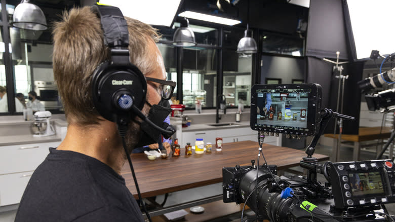 A cameraman filming America's Test Kitchen