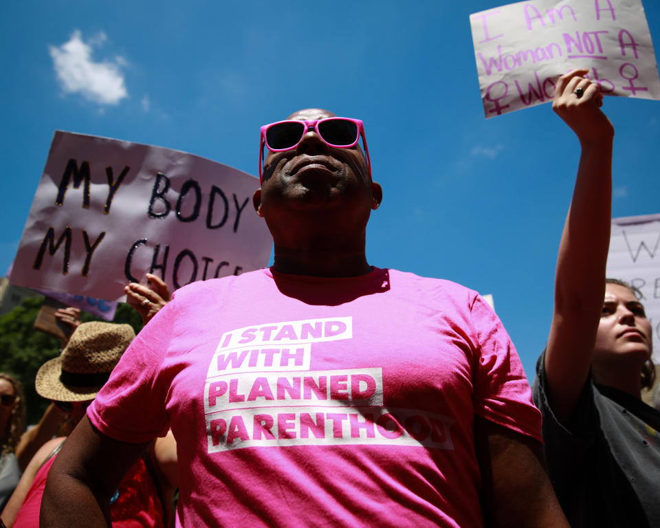 ATLANTA, GA - MAY 21: A man wears a &quot;I stand with Planned Parenthood&quot; shirt at a protest against recently passed abortion ban bills at the Georgia State Capitol building, on May 21, 2019 in Atlanta, Georgia. The Georgia &quot;heartbeat&quot; bill would ban abortion when a fetal heartbeat is detected. The Alabama abortion law, signed by Gov. Kay Ivey last week, includes no exceptions for cases of rape and incest, outlawing all abortions except when necessary to prevent serious health problems for the woman. Though women are exempt from criminal and civil liability, the new law punishes doctors for performing an abortion, making the procedure a Class A felony punishable by up to 99 years in prison (Photo by Elijah Nouvelage/Getty Images)