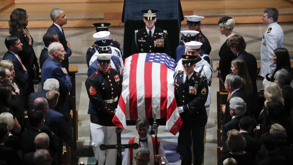 The family of Sen. John McCain, R-Ariz., follows as his casket is carried during the recessional at the end of a memorial service at Washington National Cathedral in Washington, Saturday, Sept. 1, 2018. McCain died Aug. 25, from brain cancer at age 81. (AP Photo/Pablo Martinez Monsivais)