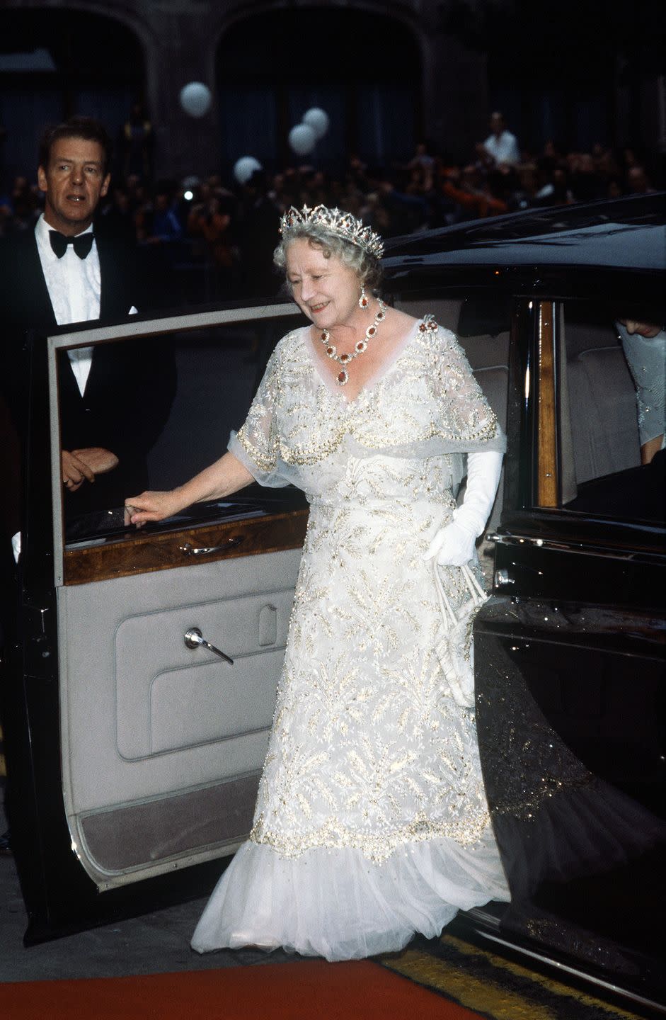 <p>Queen Elizabeth, the Queen Mother, wore a white chiffon evening gown to her 80th birthday celebration in 1980. She paired the gown with a stunning tiara and necklace set. </p>