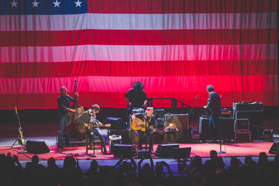 Willie Nelson (center) performs at the Outlaw Music Festival on Sunday at the PNC Bank Arts Center in Holmdel.