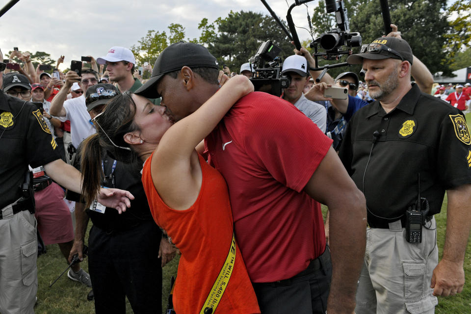 Tiger Woods and girlfriend Erica Herman kiss after the final round Sunday of the Tour Championship in Atlanta. (Photo: Stan Badz via Getty Images)