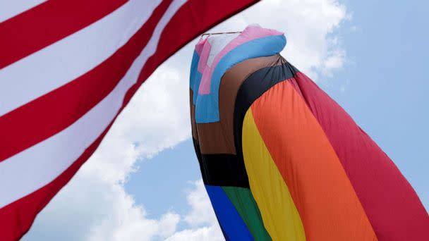 PHOTO: The U.S. and Rainbow flag blows in the wind during an all ages LGBTQ Pride event in Franklin, Tennessee, June 3, 2023. (Kevin Wurm/Reuters)