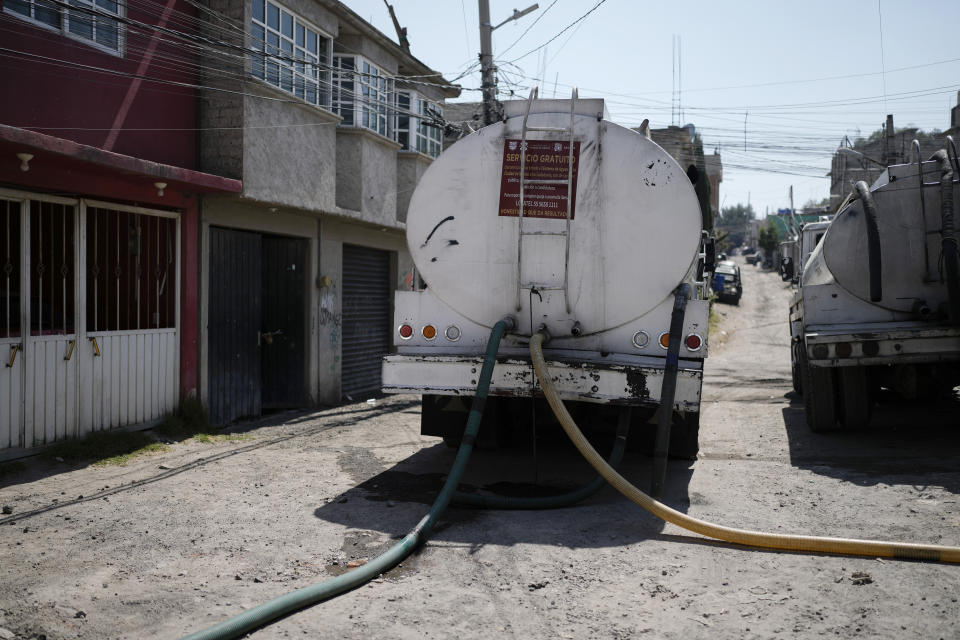 A water truck from the local government delivers free water in Iztapalapa, on the outskirts of Mexico City, Wednesday, March 6, 2024. Neighborhoods not connected to underground aquifers and a vast network of canals, dams and reservoirs known as the Cutzamala System, are feeling the pinch of hot temperatures and delayed water deliveries by trucks. (AP Photo/Eduardo Verdugo)