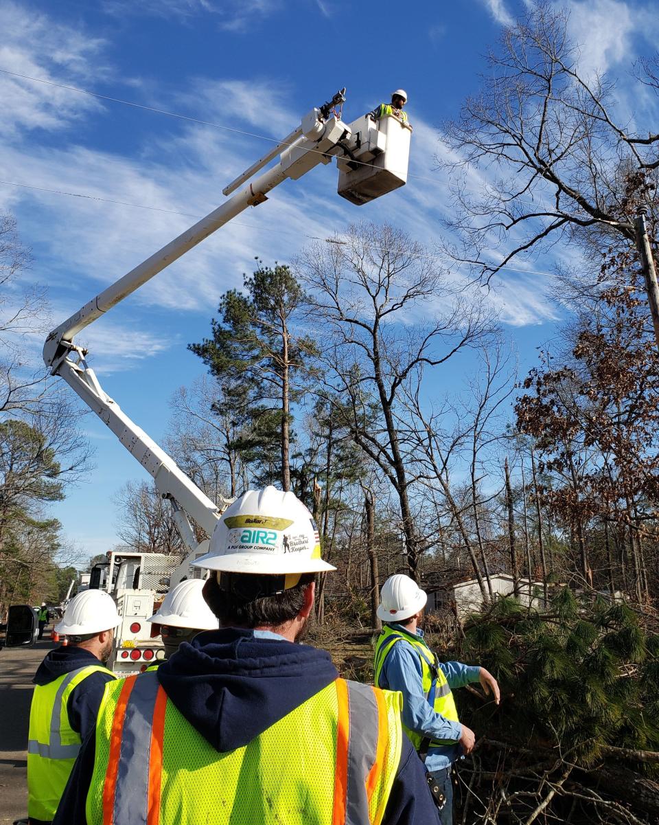 SWEPCO crews work to restore power.