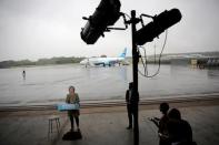 U.S. Democratic presidential candidate Hillary Clinton speaks to the media before boarding her campaign plane at the Westchester County airport in White Plains, New York, U.S. September 19, 2016. REUTERS/Carlos Barria