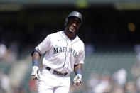 Seattle Mariners' Taylor Trammell smiles as he rounds the bases after hitting a solo home run during the sixth inning a baseball game, Wednesday, June 23, 2021, in Seattle. The hit ended Marquez's no hitter to that point. (AP Photo/John Froschauer)