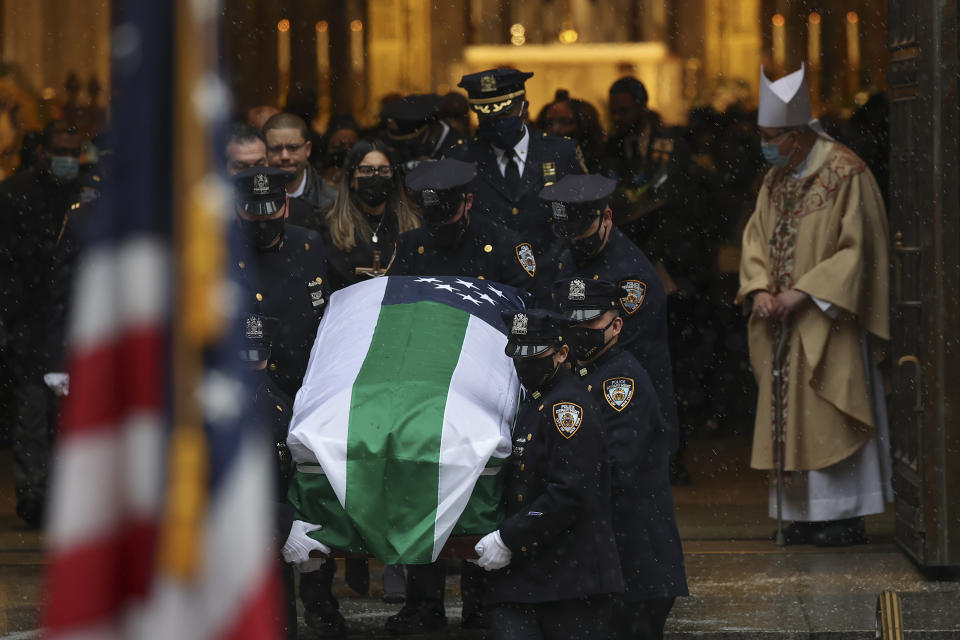 New York Police pall bearers carry the casket of NYPD Officer Jason Rivera out of St. Patrick's Cathedral after his funeral service, Friday, Jan. 28, 2022, in New York. Rivera and his partner, Officer Wilbert Mora, were fatally wounded when a gunman ambushed them in an apartment as they responded to a family dispute last week. (AP Photo/Yuki Iwamura)