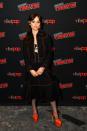 <p>To attend a panel talk at 2022's New York Comic Con, Jenna Ortega opted for a particularly out-there gothic-glam look. The actor paired a dark denim Gucci skirt suit with a lacy bra, patterned tights and bright red platform heels. </p>