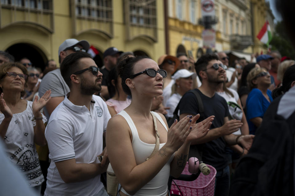 People clap during Péter Magyar's speech at a campaign rally in the rural city of Debrecen, Hungary, on Sunday, May 5, 2024. Magyar, whose TISZA party is running in European Union elections, has managed to mobilize large crowds of supporters on a campaign tour of Hungary's heartland, a rarity for an Orbán opponent. (AP Photo/Denes Erdos)