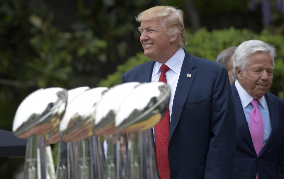 President Donald Trump, followed by New England Patriots owner Robert Kraft, arrives to speak during a ceremony on the South Lawn of the White House in Washington, Wednesday, April 19, 2017, where the president honored the Super Bowl Champion New England Patriots for their Super Bowl LI victory. (AP Photo/Susan Walsh)