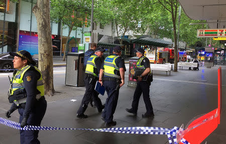 Police officers block members of the public from walking towards the Bourke Street mall in central Melbourne, Australia, November 9, 2018. REUTERS/Sonali Paul