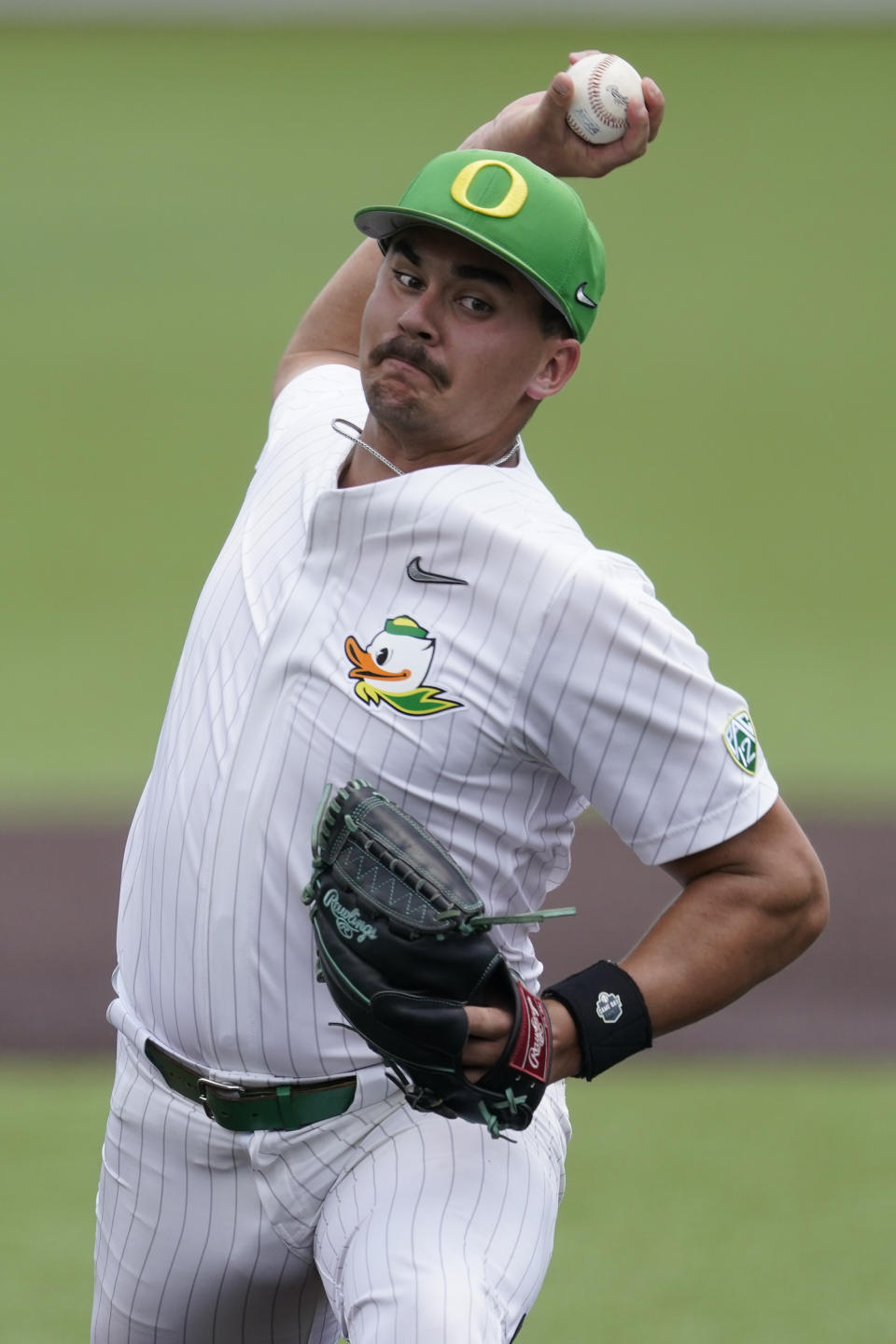 Oregon pitcher Logan Mercado pitches against Xavier during the first inning of an NCAA college baseball tournament regional game, Friday, June 2, 2023, in Nashville, Tenn. (AP Photo/George Walker IV)