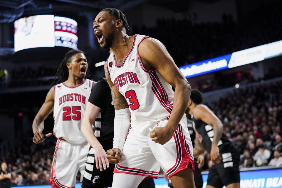 Houston forward J'Wan Roberts reacts after a dunk during the second half of an NCAA basketball game against Cincinnati, Saturday, Feb. 10, 2024, in Cincinnati. (AP Photo/Joshua A. Bickel)