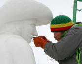 The captain of Team USA Breckenridge, Keith Martin shaving away snow of a bull rider's mustache on his 12 foot tall, 20-ton sculpture at the outdoor art gallery during the 23rd Annual International Snow Sculpture Championships in Breckenridge, Colo., on Friday, Jan. 25, 2013. Martin is joined with 15 international teams, the sculptures will remain on display through Feb. 3, 2013 (weather permitting). Visit www.gobreck.com for more information. (Nathan Bilow / AP Images for The Breckenridge Resort Chamber)