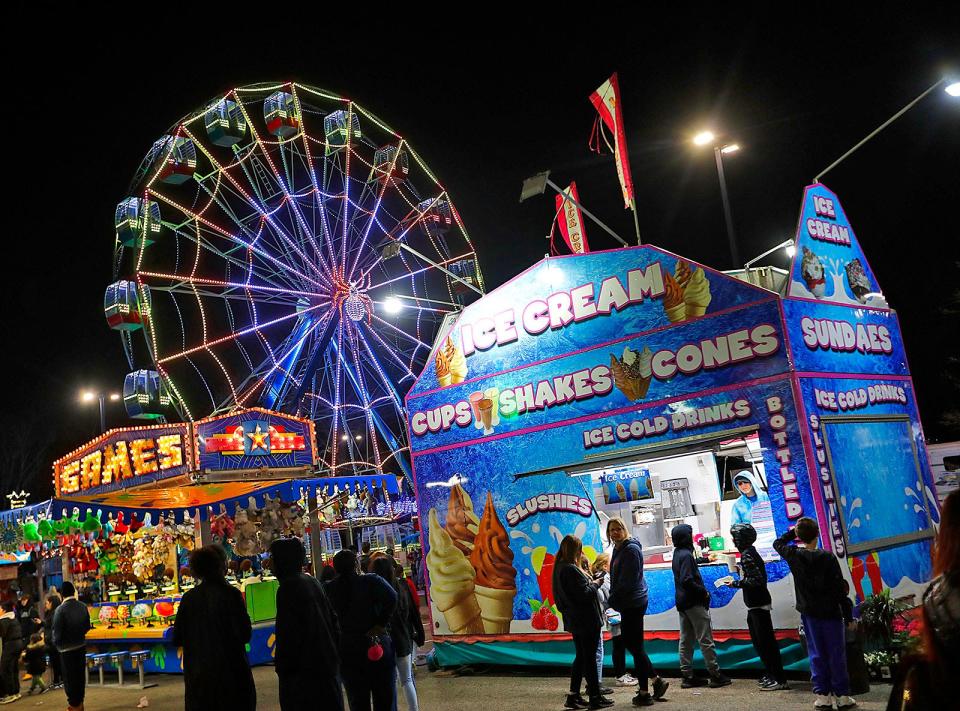 A traveling carnival lights up the night at Weymouth High School during April vacation on Friday April 21, 2023 