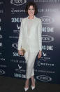 For a downtown New York movie premiere, Hathaway wore a blazer by IRO with a sheer white T-shirt, cropped pants, and matching heels.