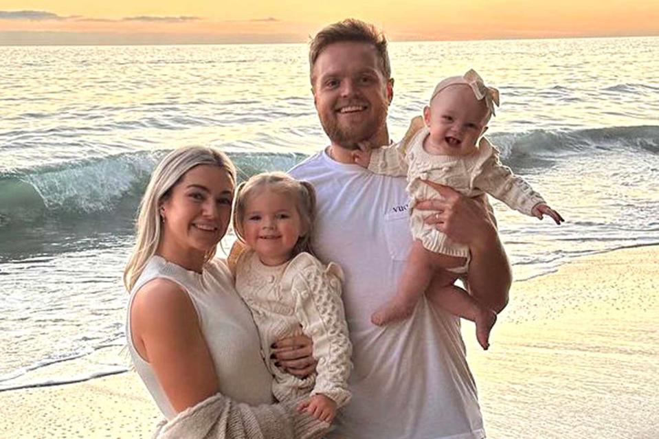 <p>Lindsey Arnold/Instagram</p> Lindsey Arnold poses for a photo with her husband and their daughters