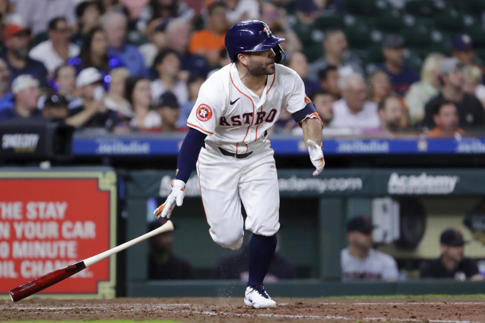 Houston Astros’ Jose Altuve flips his bat as he watches his RBI single, scoring Mauricio Dubon, against the Cleveland Guardians during the sixth inning of a baseball game Wednesday, May 1, 2024, in Houston. (AP Photo/Michael Wyke)