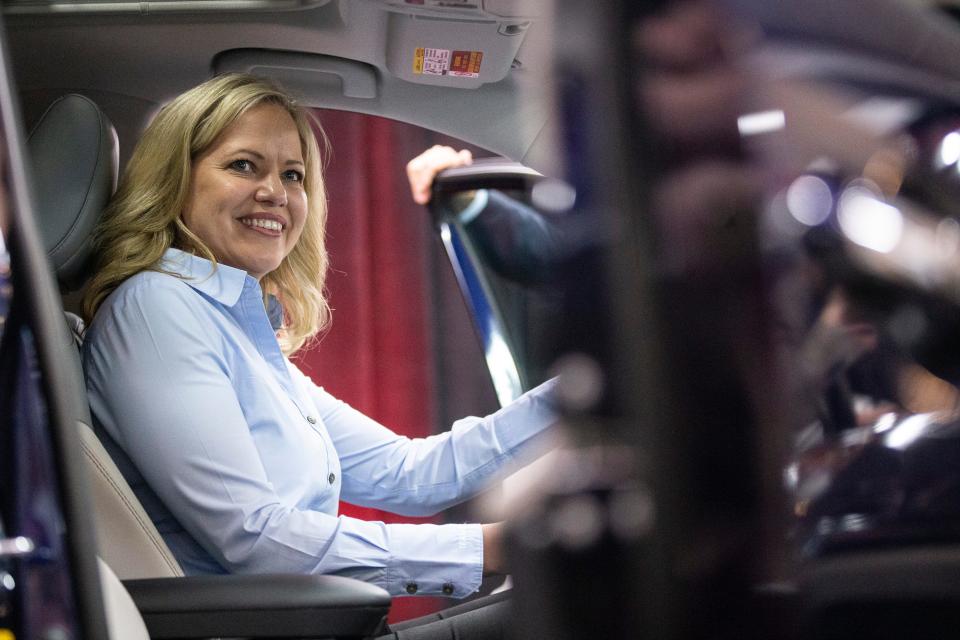 Toyota Kentucky President Susan Elkington sits in a new RAV4 Hybrid model Thursday. Toyota announced the future production of the new Lexus ES 300 Hybrid and the RAV4 Hybrid at the Georgetown, Kentucky plant on Thursday. The car company plans to invest $13 billion over the next five years in the U.S. with $238 million coming to Kentucky. March 14, 2019