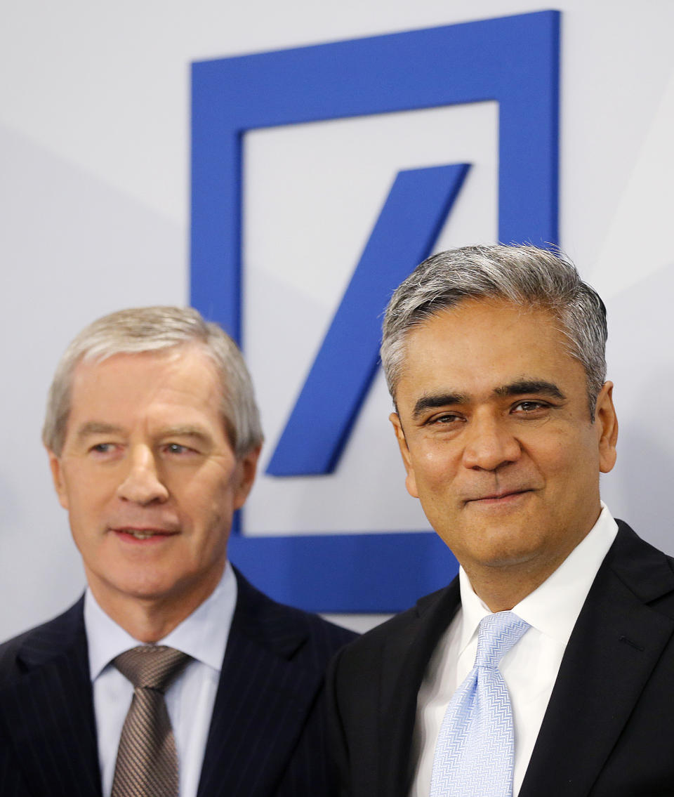 CEOs of Deutsche Bank Anshu Jain, right, and Juergen Fitschen stand together prior to the annual press conference in Frankfurt, Germany, Wednesday, Jan. 29, 2014. Germany's biggest bank had a surprise loss of 965 million euros (US dollar 1.32 billion) in the fourth quarter, as earnings were burdened by 528 million in costs for court settlements and investigations into alleged past misconduct in the fourth quarter. (AP Photo/Michael Probst)