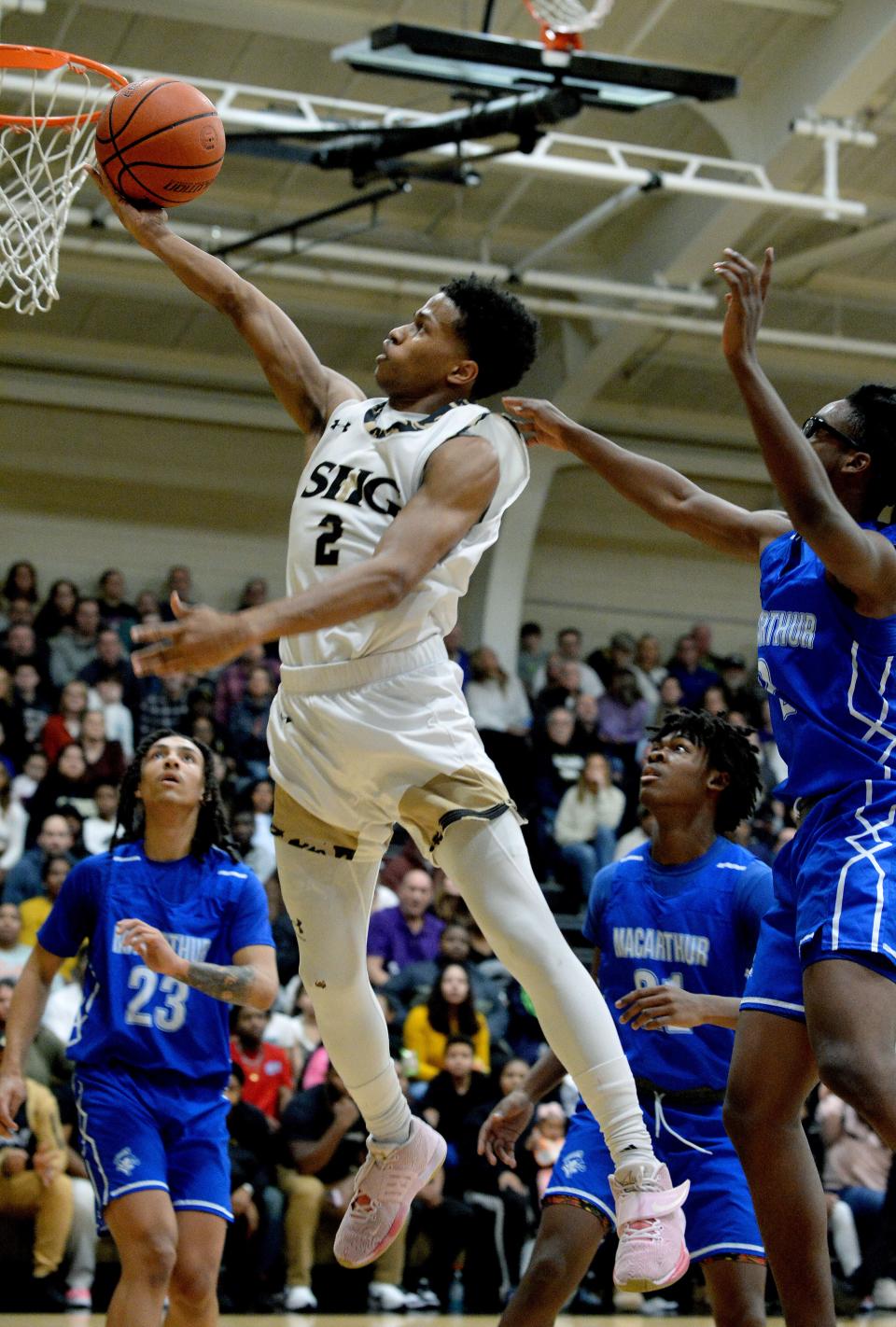 Sacred Heart-Griffin's J'veon Bardwell goes up for a shot during the game against Decatur MacArthur High School on Friday.