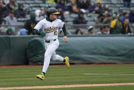 Oakland Athletics' Nick Allen looks back as he scores a run against the Washington Nationals on Abraham Toro's double during the seventh inning of a baseball game Saturday, April 13, 2024, in Oakland, Calif. (AP Photo/Godofredo A. Vásquez)