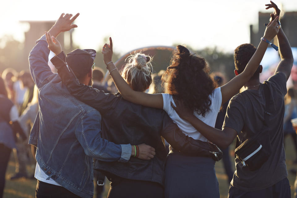 Friends hanging out at big music festival