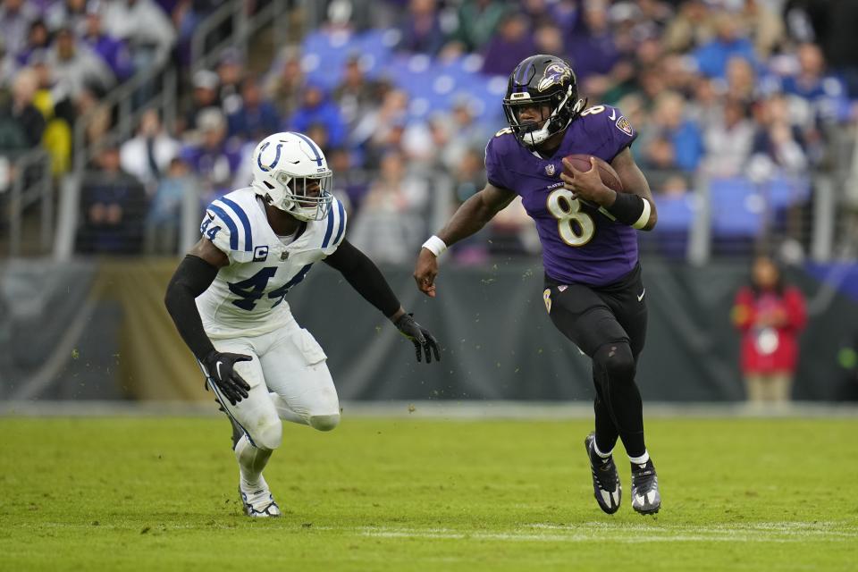 Baltimore Ravens quarterback Lamar Jackson is chased by Indianapolis Colts' Zaire Franklin (44) during the second half of an NFL football game, Sunday, Sept. 24, 2023, in Baltimore. (AP Photo/Julio Cortez)