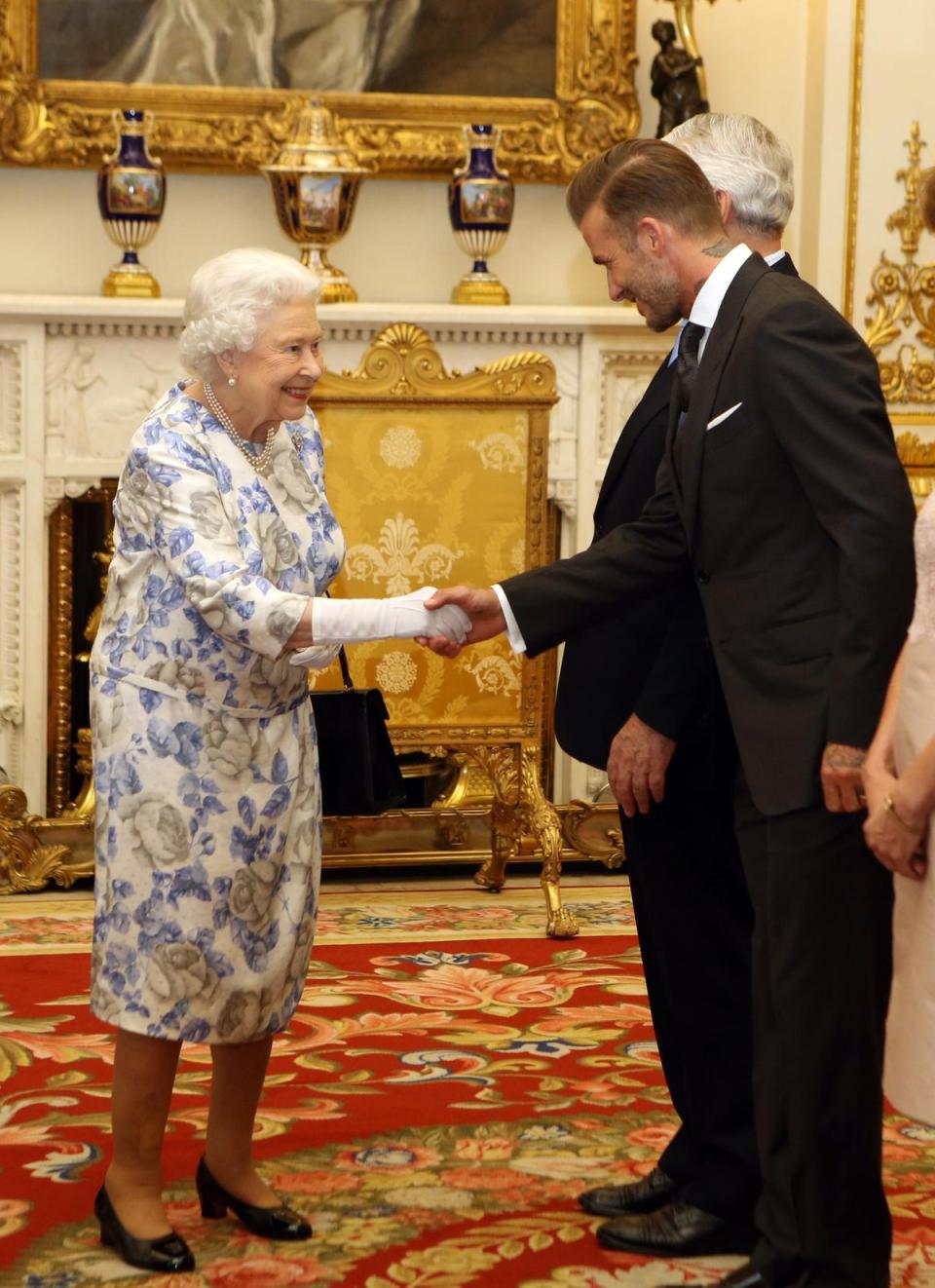 David Beckham: The monarch greets the retired footballer during the Young Leaders Awards at Buckingham Palace, 23 June 2018 (Getty Images)