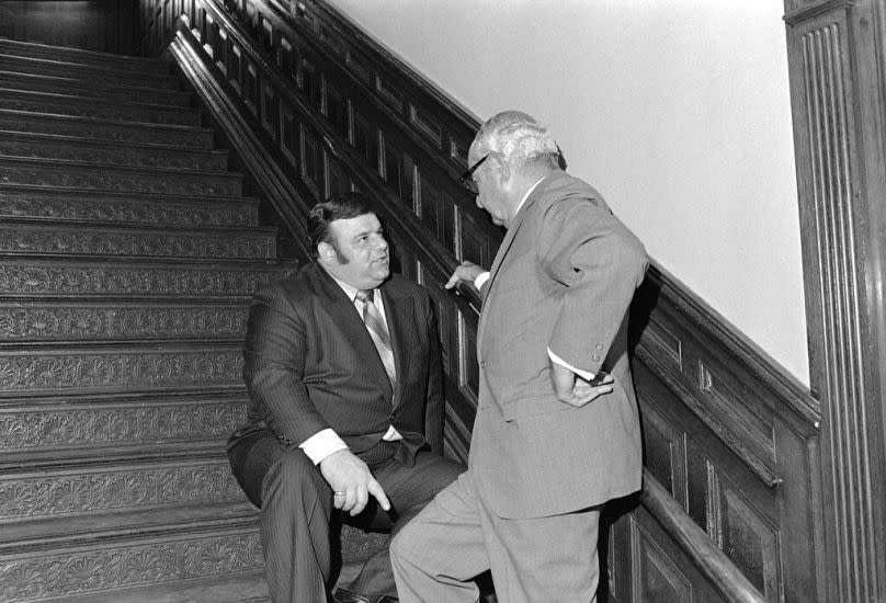 Anthony Imperiale (left), discusses congressional redistricting with Essex Democratic Chairman Harry Lerner in Trenton, 10 April 1972