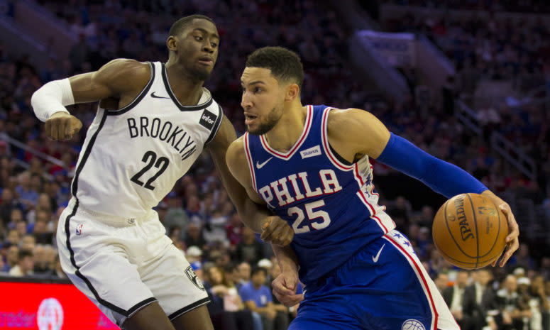 76ers point guard Ben Simmons drives past Caris LeVert on his way to the basket.