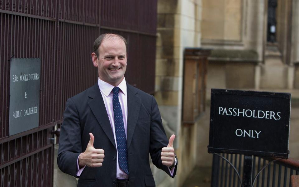 Tory defector Douglas Carswell arrives to take his seat at the House of Commons - Heathcliff O'Malley