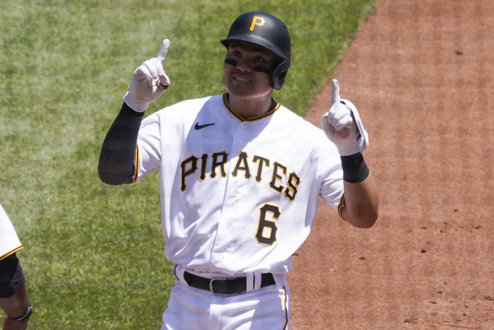 Pittsburgh Pirates' Yu Chang points skyward after getting a base hot against the Detroit Tigers in the third inning of a baseball game, Wednesday, June 8, 2022, in Pittsburgh. (AP Photo/Keith Srakocic)