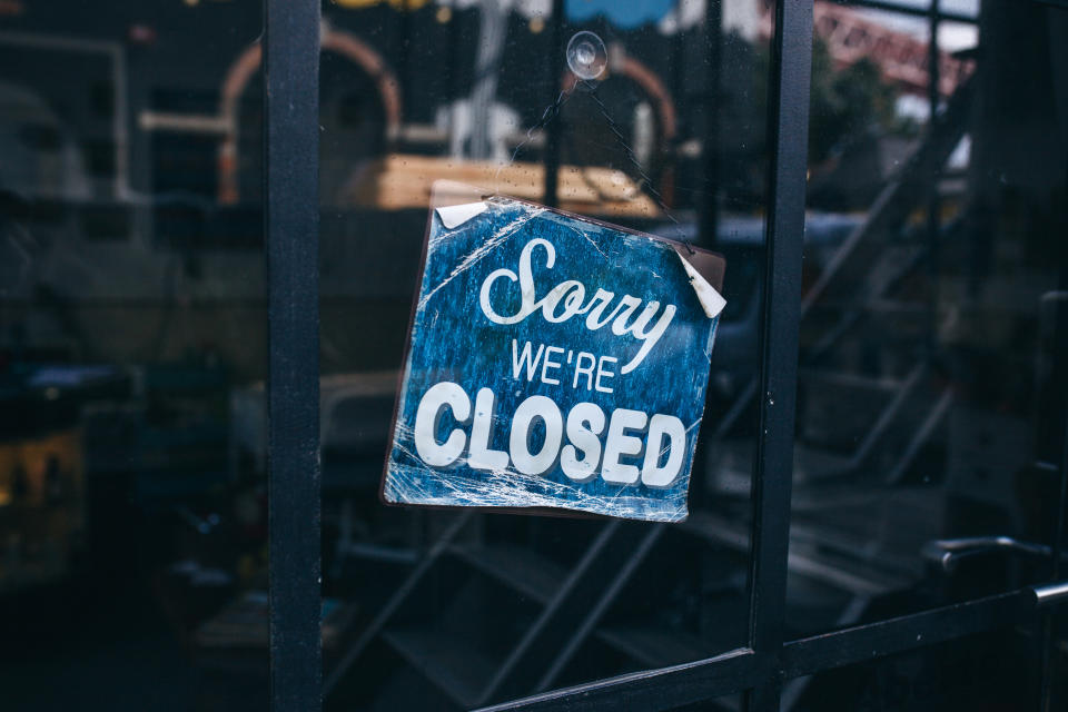 Inscription on a door: Sorry we are closed. Conceptual photo or table on door with information of work. Announcement or work schedule.