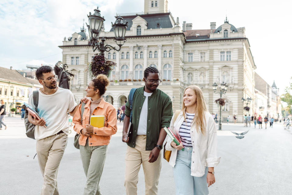 A group of college students are walking together after class