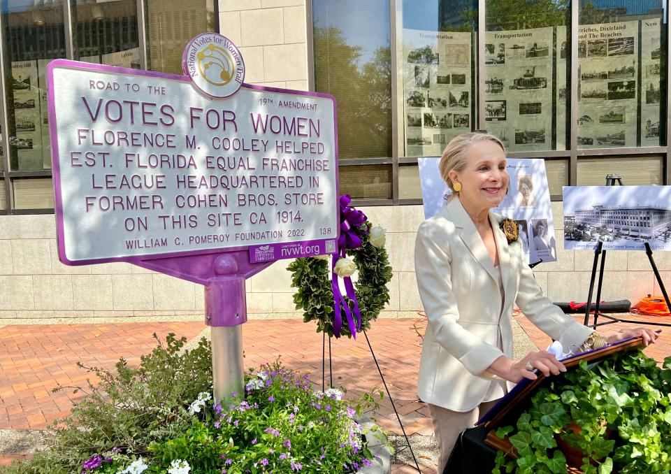 Emily Lisska, former executive director of the Jacksonville Historical Society, speaks at the Women's Club of Jacksonville's unveiling of a marker in front of City Hall as part of the National Votes for Women Trail. The marker recognizes Florence Murphy Cooley for helping to establish the Florida Equal Franchise League — the first women's suffrage organization in Jacksonville — in the building, then Cohen Brothers department store, in 1914.