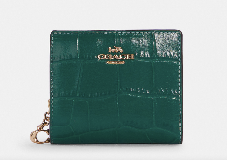 dark green leather Snap Wallet (Photo via Coach Outlet)