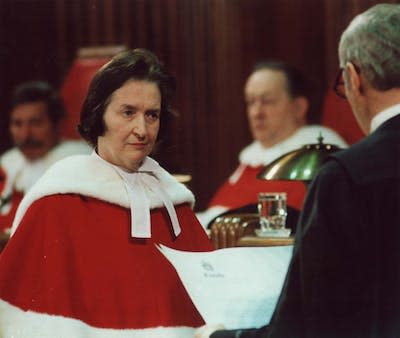 Justice Bertha Wilson listens as the court registrar reads the proclamation appointing her to the Supreme Court of Canada during a ceremony in Ottawa in 1982. (CP PHOTO)