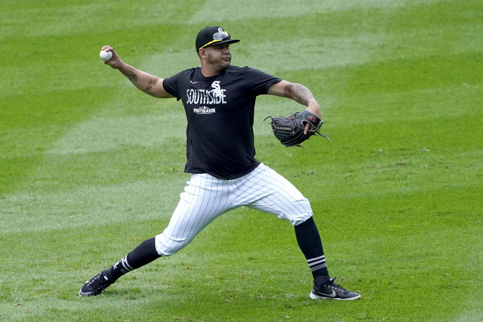 Chicago White Sox's Carlos Rodon throws a short pitching session after Game 4 of an ALDS baseball game was postponed due to a forecast of inclement weather Monday, Oct. 11, 2021, in Chicago. The makeup game is scheduled for Tuesday afternoon at Guaranteed Rate Field. (AP Photo/Charles Rex Arbogast)