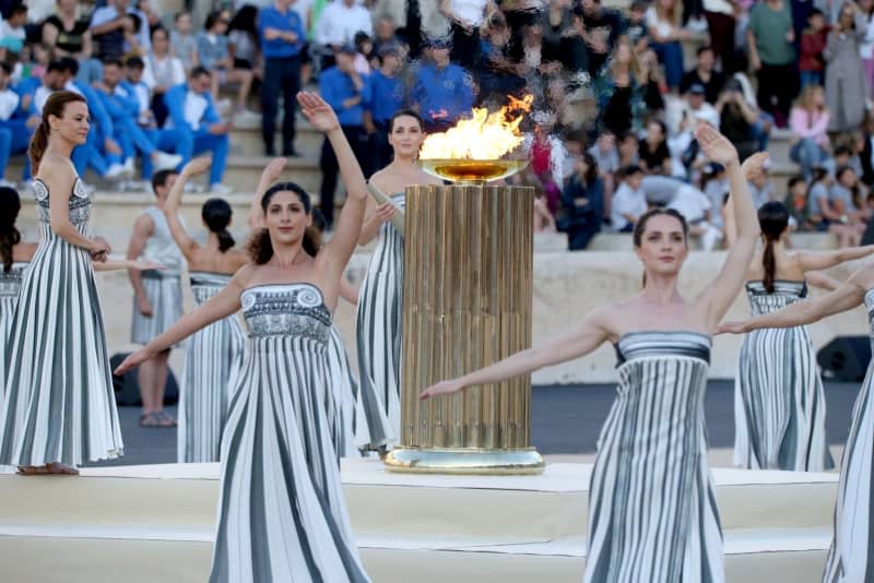 Greek actresses playing the role of priestesses perform during the Olympic Flame handover ceremony, at the Panathenaic Stadium in Athens. Aristidis Vafeiadakis/ZUMA Press Wire/dpa