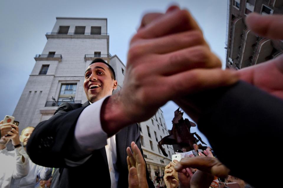 Five-Stars Movement (M5S) leader Luigi Di Maio salutes the crowd during a rally in Naples, Italy, Tuesday, May 29, 2018. (Ciro Fusco/ANSA via AP)