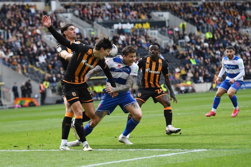 Alfie Jones of Hull City battles with Lyndon Dykes of QPR