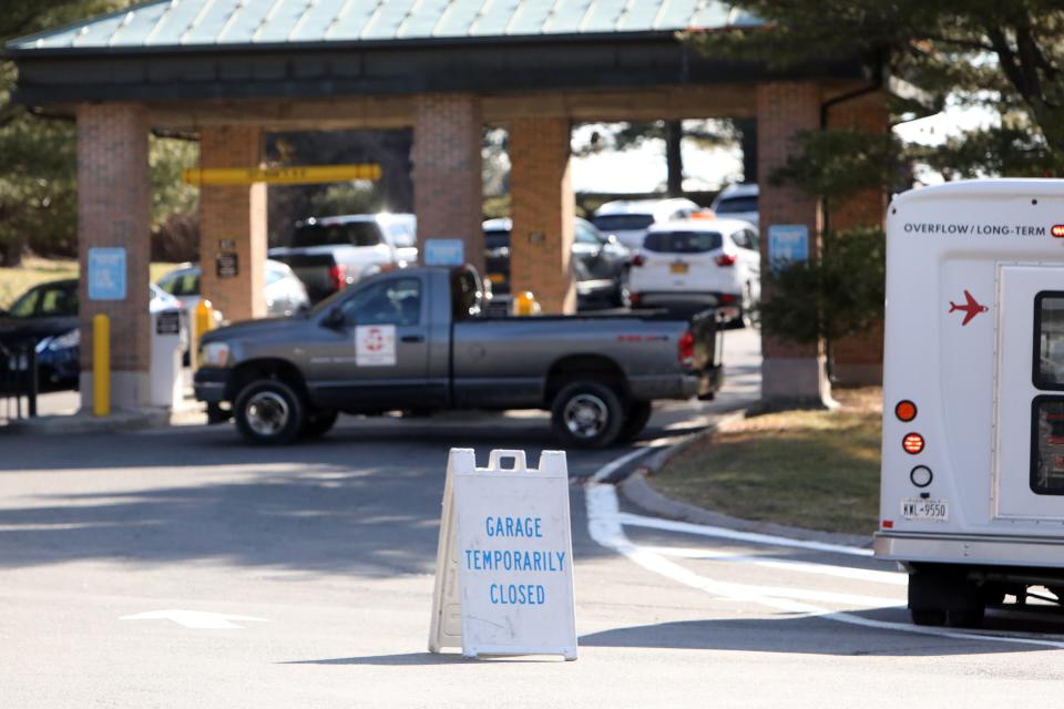 A sign saying the parking garage is closed is placed outside the entrance to the Westchester County Airport parking garage Jan. 27, 2023. 