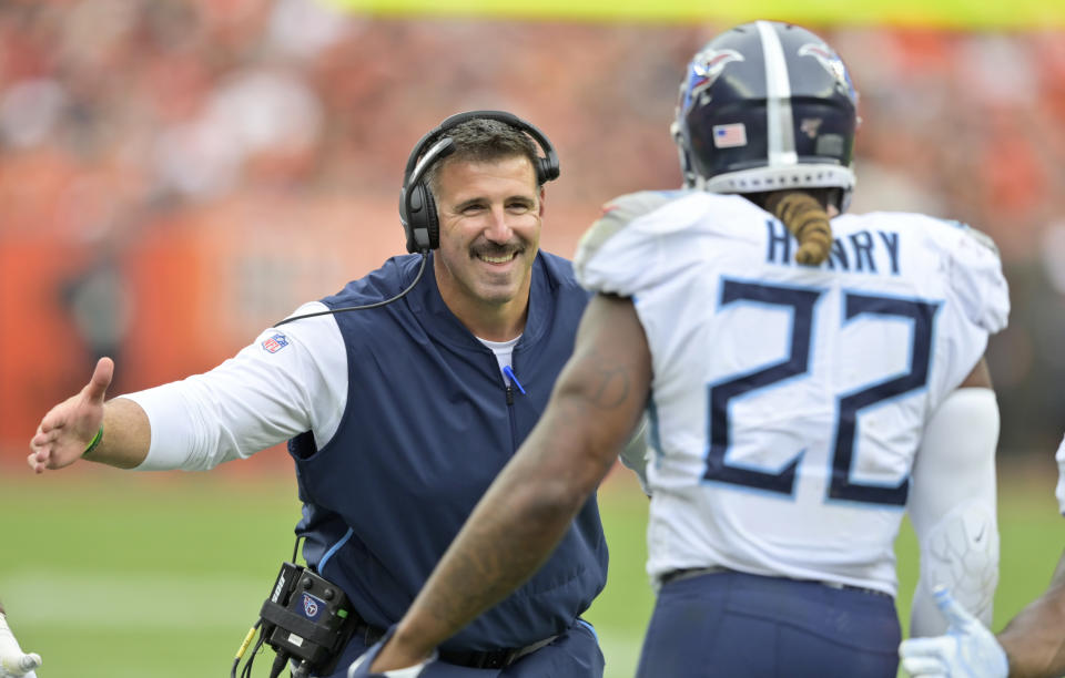 Tennessee Titans head coach Mike Vrabel, left, congratulates running back Derrick Henry after Henry scored a 1-yard touchdown during the first half in an NFL football game against the Cleveland Browns, Sunday, Sept. 8, 2019, in Cleveland. (AP Photo/David Richard)