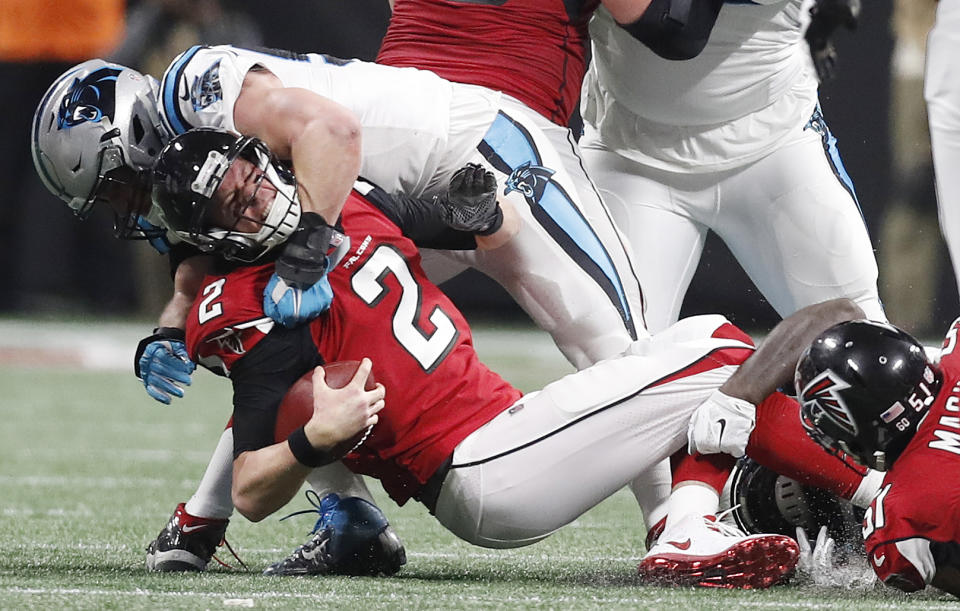 <p>Carolina Panthers middle linebacker Luke Kuechly (59) sacks Atlanta Falcons quarterback Matt Ryan (2) during the second half of an NFL football game, Sunday, Dec. 31, 2017, in Atlanta. (AP Photo/David Goldman) </p>