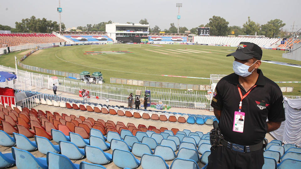 A Pakistani security forces personnel, pictured here in the cricket stadium following the cancellation.