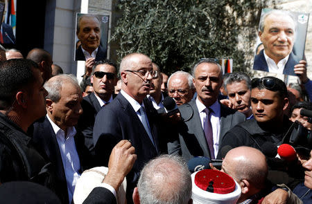 Palestinian Prime Minister Rami Hamdallah speaks after he survived an assassination attempt in Gaza, at his office in the Ramallah, in the occupied West Bank March 13, 2018. REUTERS/Mohamad Torokman